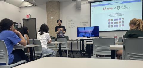 Students listen to a presenter in a classroom